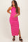 woman wearing a pink and white striped maternity maxi dress and holding her baby bump
