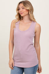 woman wearing a light purple ribbed tank top with a scoop neckline and casual fit