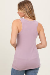 woman wearing a lavender ribbed tank top, shown from the back, paired with light blue jeans