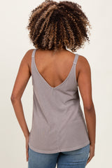 woman wearing a gray maternity tank top with a deep V-back, showing her back and curly hair