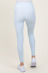 woman wearing light blue maternity leggings from the back