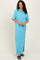 woman wearing a light blue oversized t-shirt dress with short sleeves and side slits