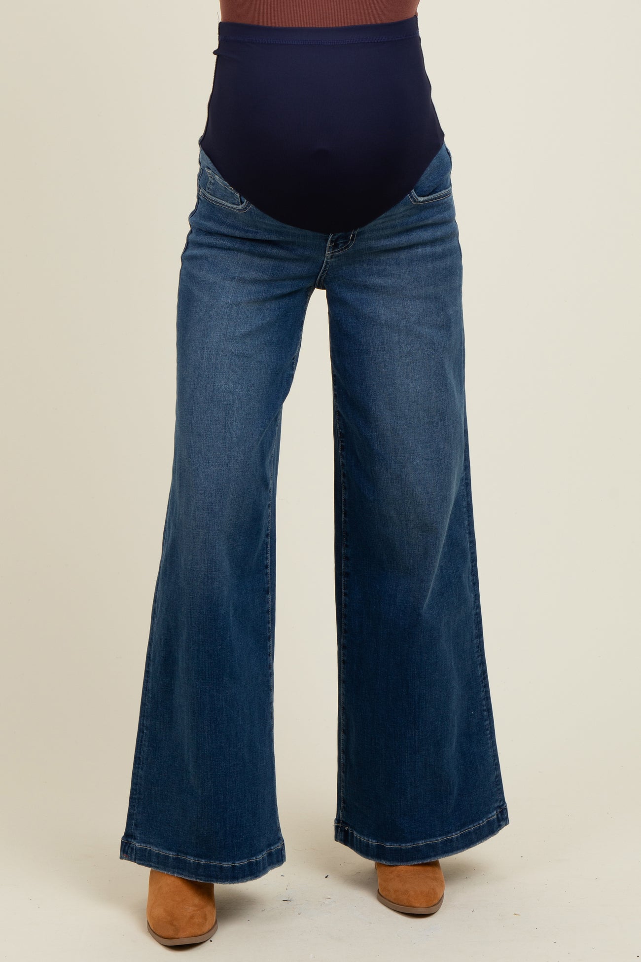 woman wearing dark blue maternity wide-leg jeans with a stretchy high waistband
