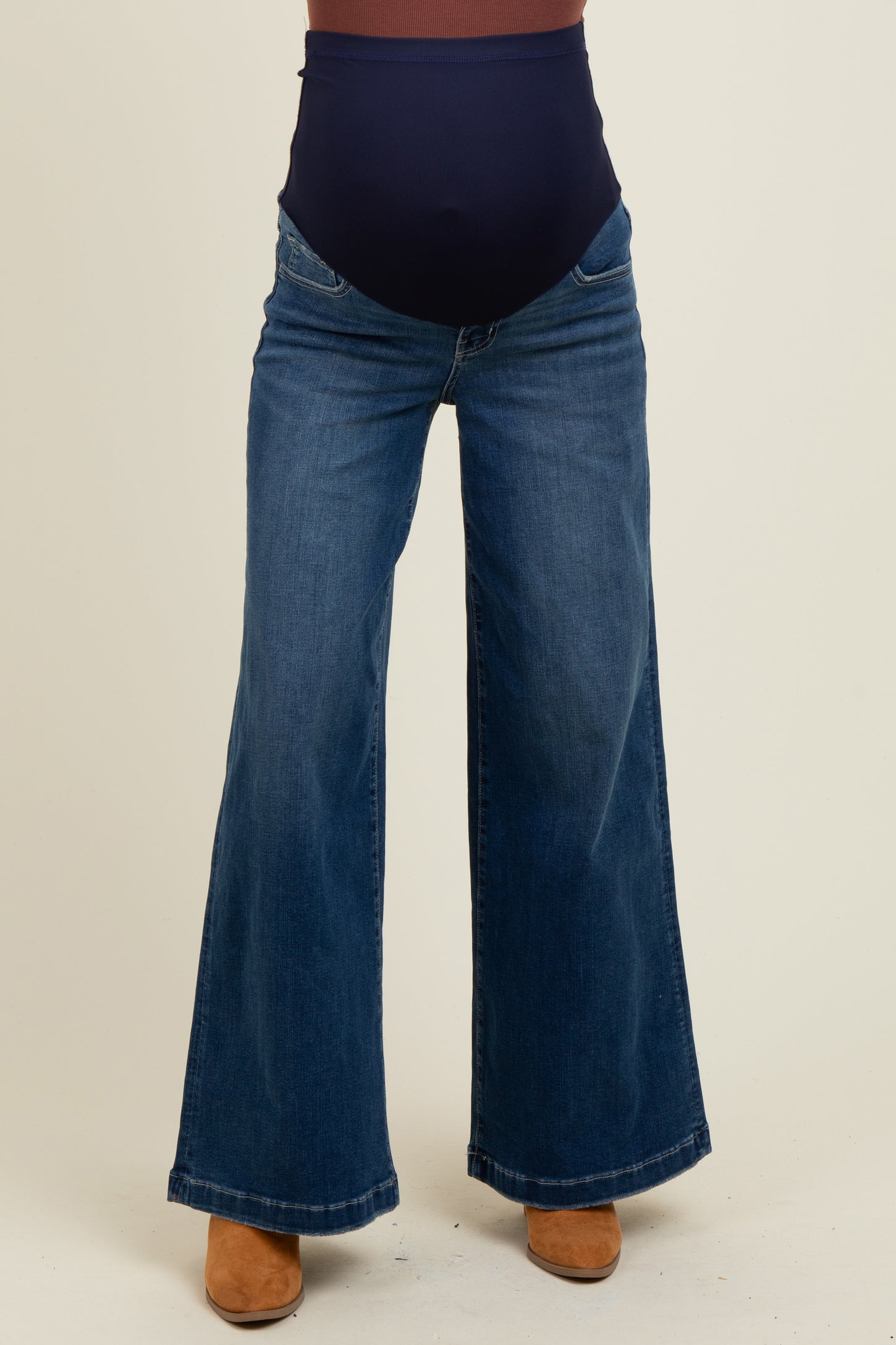 woman wearing dark blue maternity wide-leg jeans with a stretchy high waistband