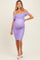 woman wearing a light purple off-the-shoulder maternity dress with ruching and a visible baby bump