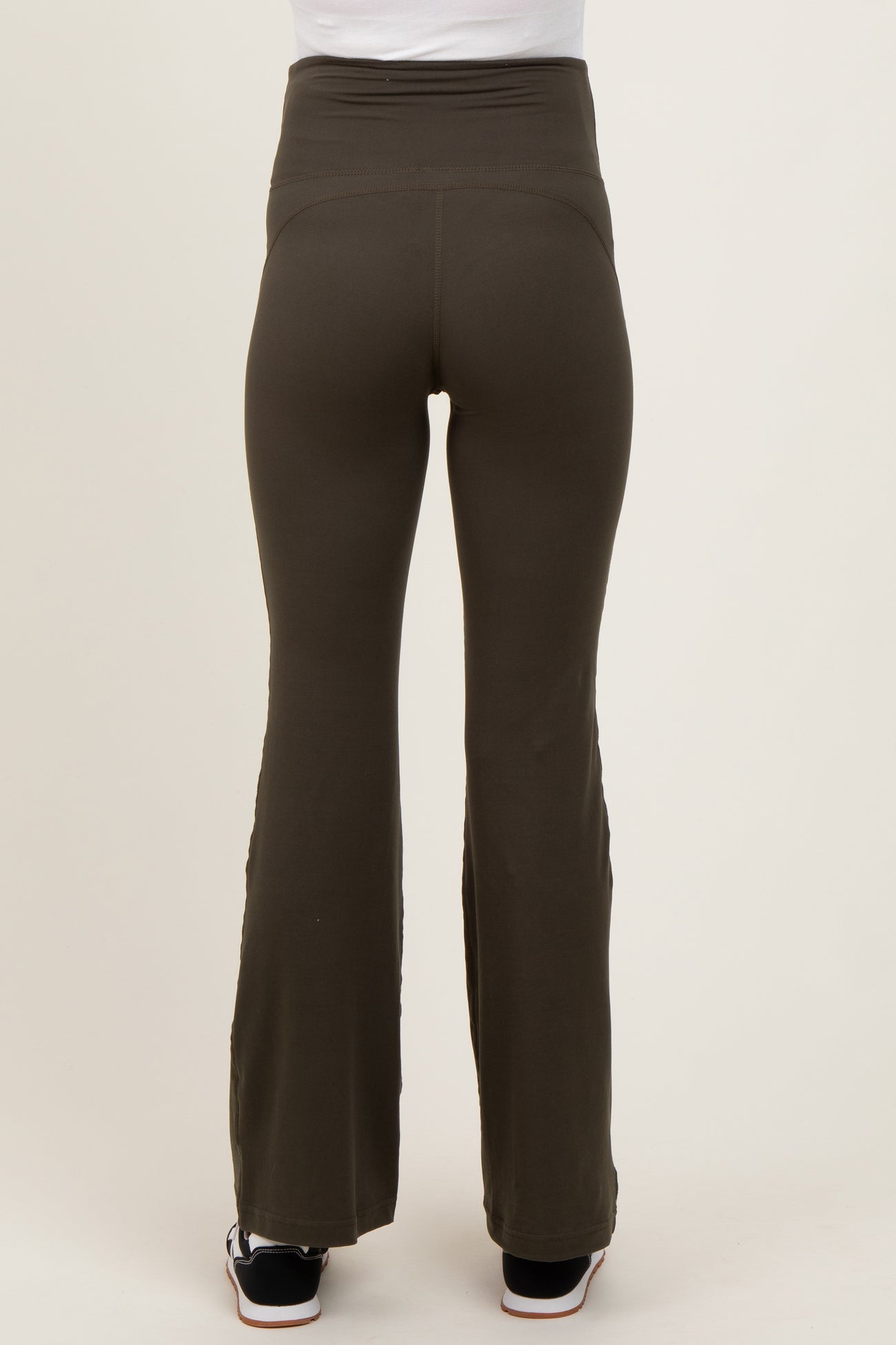 maternity wear olive green flared pants with a high waistband, shown from the back