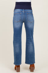 woman wearing blue maternity jeans with a stretchy navy waistband, viewed from the back