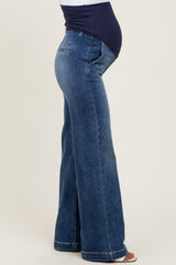 maternity wear blue denim flared jeans with a stretchy belly panel and visible baby bump
