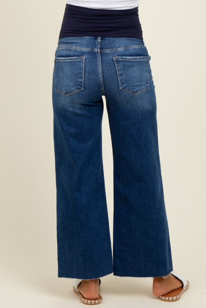 woman wearing dark blue wide-leg maternity jeans with a stretchy waistband, showing the back view