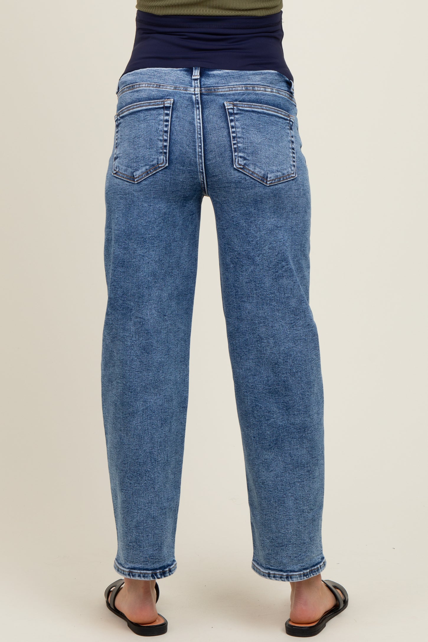 maternity wear blue high-waisted mom jeans with a relaxed fit, shown from the back