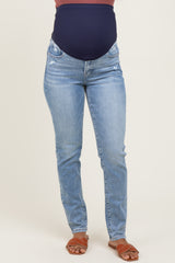 woman wearing maternity blue skinny jeans with a navy over-the-bump panel