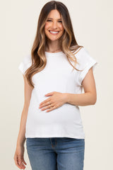 woman wearing a white short sleeve maternity top and holding her baby bump