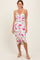 woman wearing a colorful tie-dye midi dress with a wrap design and spaghetti straps
