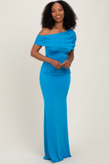 woman wearing a bright blue off-the-shoulder evening gown with gathered fabric details