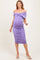 woman wearing a lavender off-shoulder maternity dress with ruched detailing and a visible baby bump