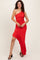 woman wearing a red one-shoulder dress with ruched details and an asymmetric hemline
