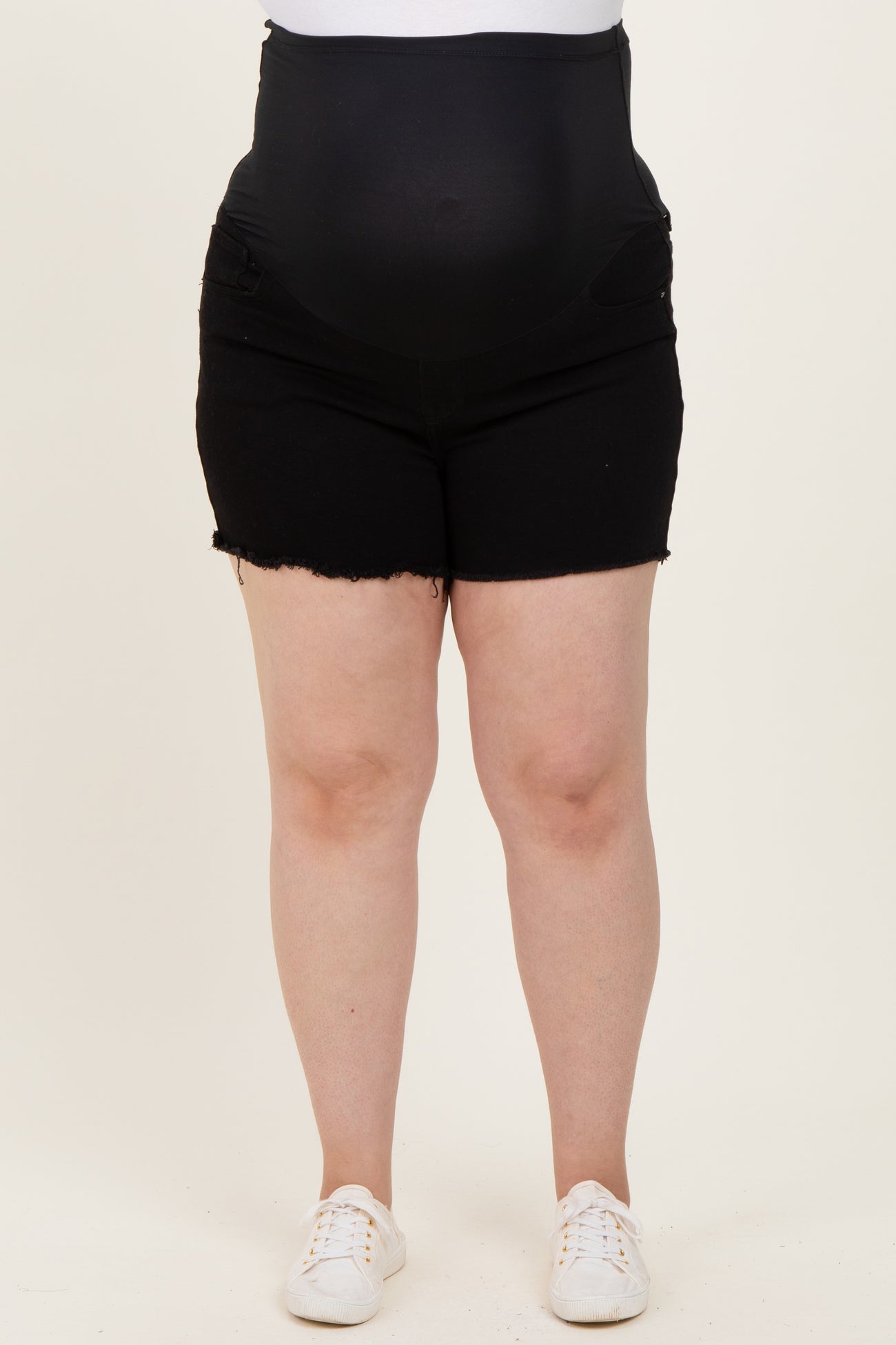 maternity plus black denim shorts with a supportive belly band and frayed hem, model showing baby bump