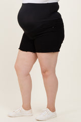 woman wearing black maternity plus shorts with a stretchy waistband and a visible baby bump