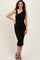 woman wearing a black one-shoulder bodycon dress with ruched detailing and a side slit