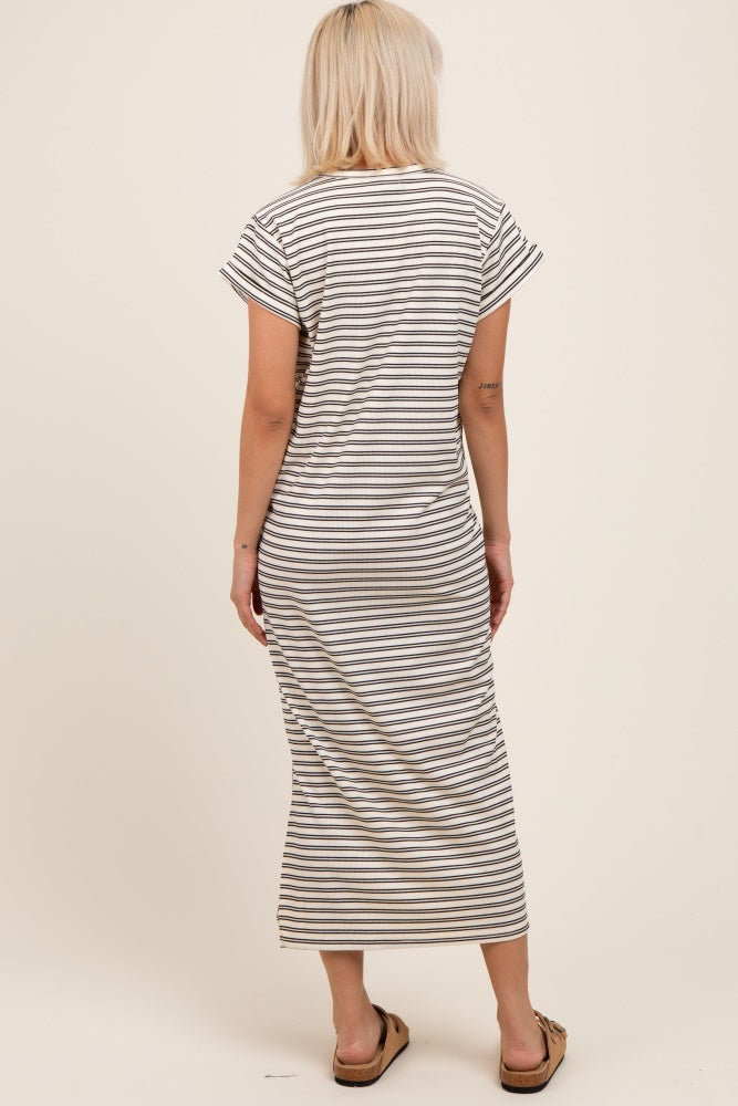 woman wearing a striped maternity maxi dress with short sleeves and a relaxed fit, showing the back view