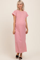 woman wearing a red and white striped maternity maxi dress and showing her baby bump