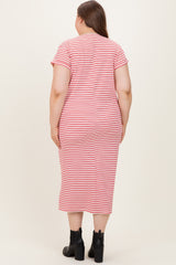woman wearing a red and white striped maternity plus dress, showing the back view with short sleeves and a fitted silhouette