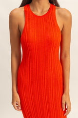 woman wearing a vibrant red ribbed knit sleeveless dress