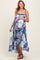 woman wearing a navy blue and white tie-dye maternity maxi dress with a flowing silhouette and an exposed baby bump