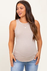 woman wearing a beige maternity tank top with a fitted style and visible baby bump