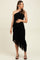 woman wearing a black asymmetrical one-shoulder maternity dress with ruching and a sheer hem, holding her baby bump