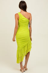 woman wearing a bright neon green one-shoulder dress with ruched detailing and a ruffled hem
