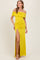 woman wearing a yellow off-shoulder maxi dress with ruching and a thigh-high slit