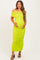 woman wearing a bright lime green off-shoulder maternity dress with ruching and holding her baby bump