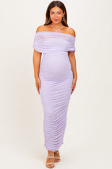 woman wearing a lavender off-the-shoulder maternity dress with ruched detailing and visible baby bump