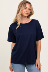 woman wearing a navy blue oversized t-shirt with short sleeves and a relaxed fit