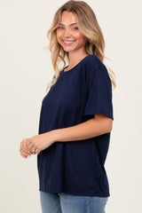 woman wearing a navy blue short sleeve relaxed fit t-shirt and smiling