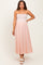 woman wearing a strapless pink maternity maxi dress with a fitted bodice and flowy skirt