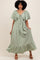woman wearing a sage green tiered maxi dress with flutter sleeves and a tie front detail