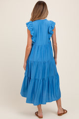 woman wearing a blue ruffle sleeve maternity maxi dress, seen from the back