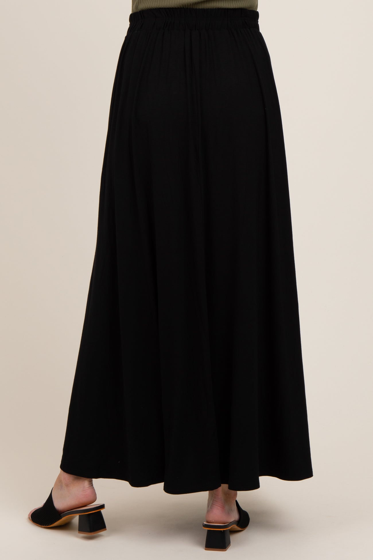 maternity wear black maxi skirt with an elastic waist, shown from the back