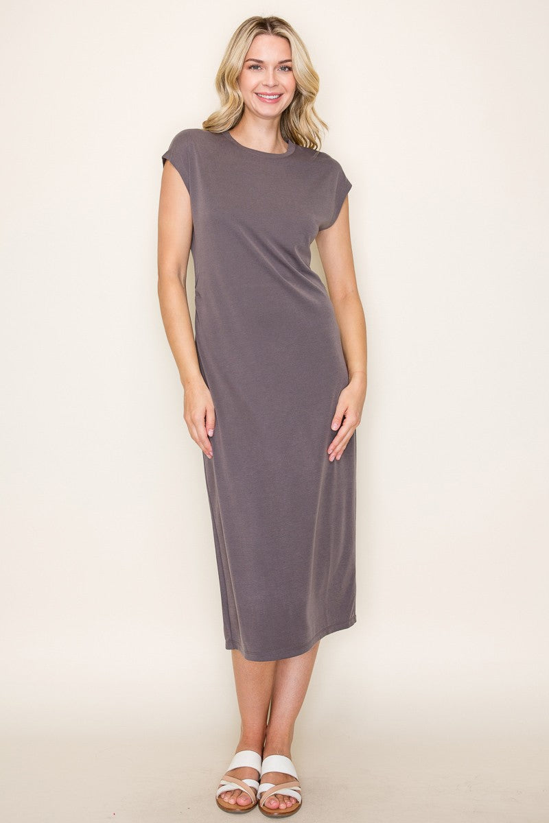 woman wearing a charcoal gray cap sleeve midi dress with a relaxed fit and standing in a neutral background