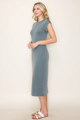 woman wearing a slate gray sleeveless midi dress with a relaxed fit and side slit details