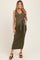 woman wearing a dark green ribbed maternity dress with a tie waist and V-neckline