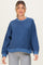 woman wearing a blue striped maternity sweatshirt with a relaxed fit and long sleeves