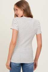 woman wearing a fitted white and navy striped t-shirt with short sleeves and side gathering