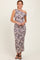 woman wearing a one-shoulder tie-dye maxi dress with ruching details and a fitted silhouette