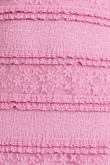 pink textured fabric with layered lace detailing