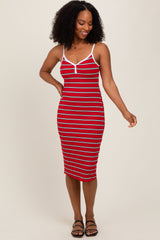woman wearing a red and white striped midi dress with spaghetti straps and a fitted silhouette
