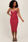 woman wearing a red and white striped midi dress with spaghetti straps and a fitted silhouette