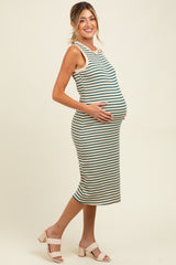 woman wearing a striped maternity dress, showing her baby bump, with a fitted silhouette and sleeveless design